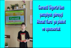 Garanti Sigorta'dan şampiyon güreşçi Ahmet Kuru`ya plaket ve sponsorluk